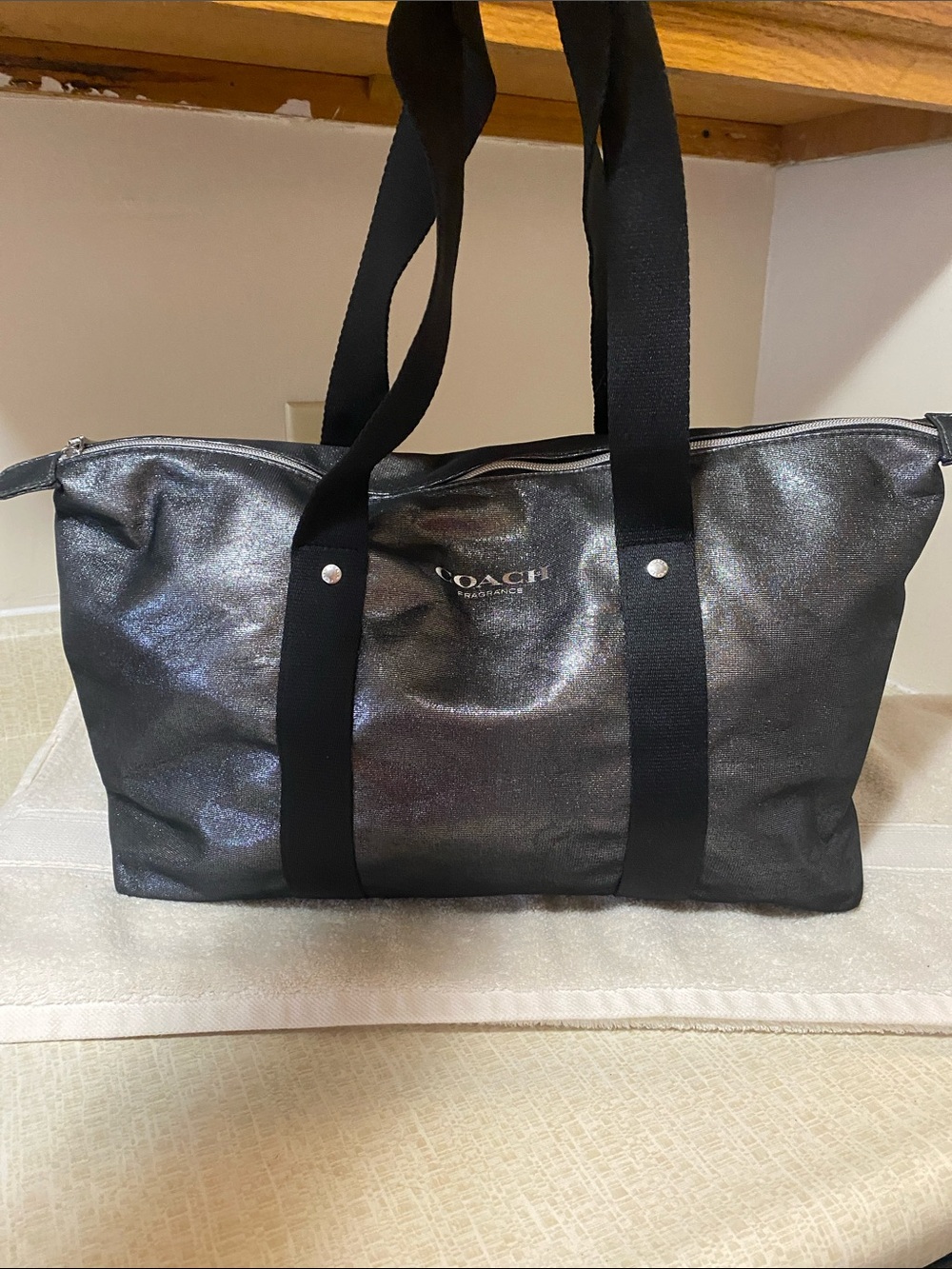 Coach Metallic Black and silver weekender or travel bag